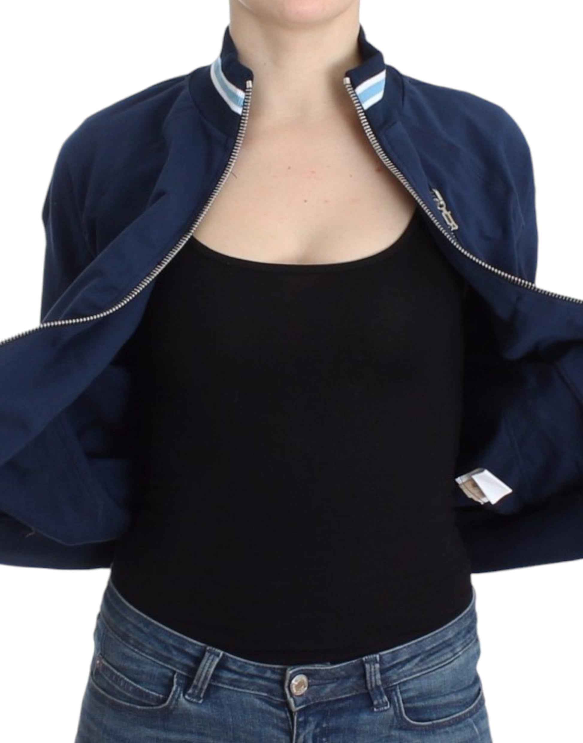 Woman wearing black tank top and blue jeans