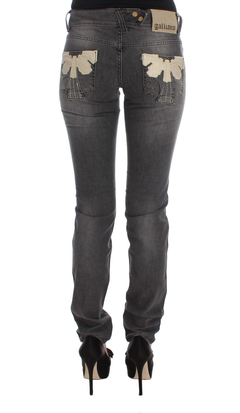 Pair of women's jeans with embroidered butterflies on thighs