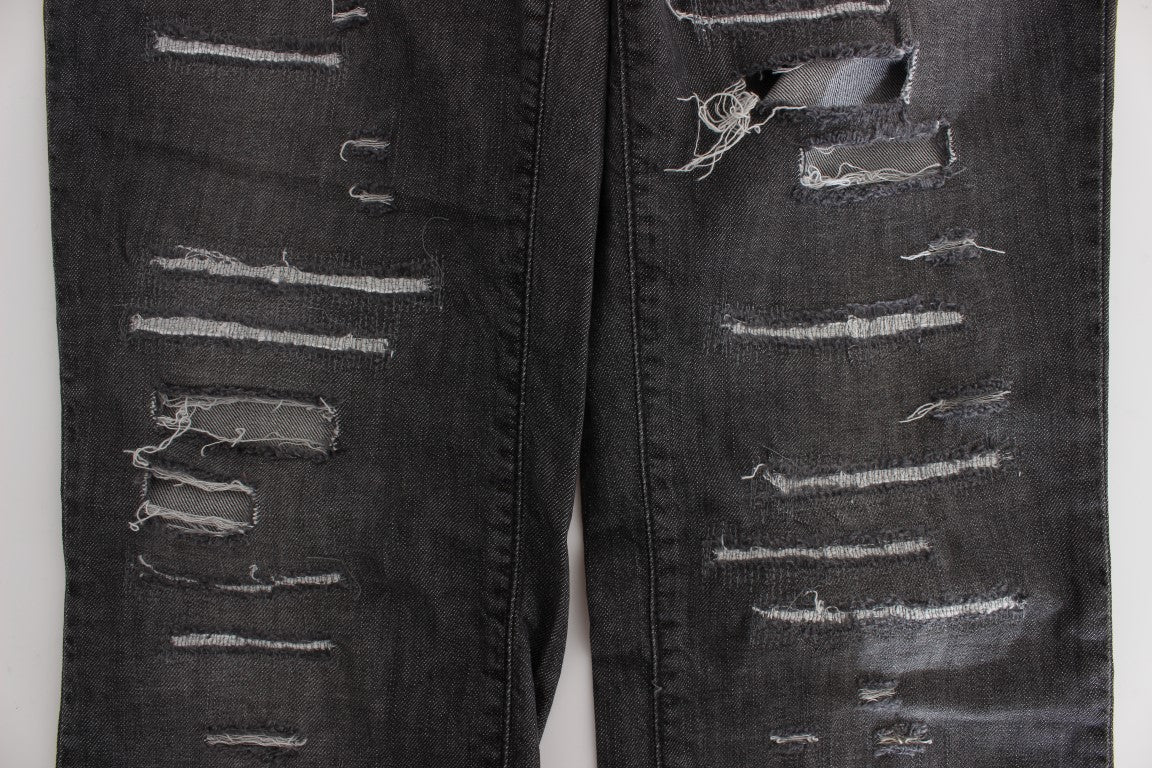 Pair of distressed jeans with rips and tears