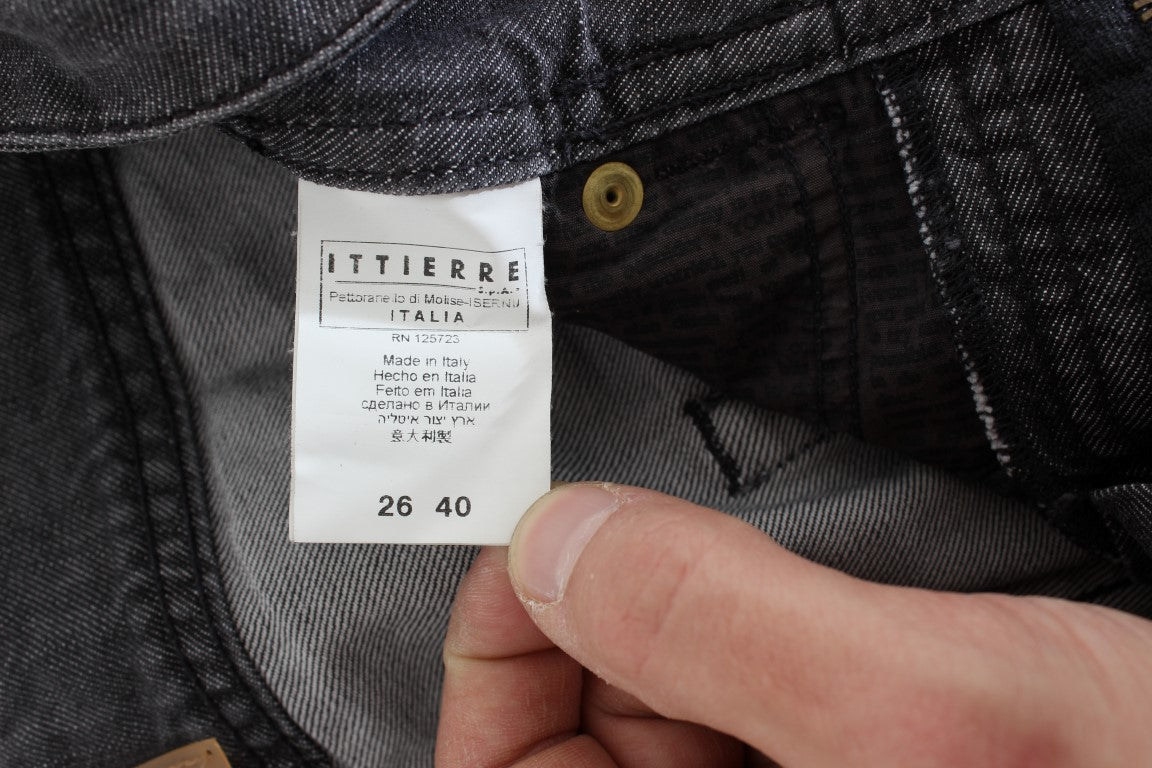 Hand holding a tag on jeans