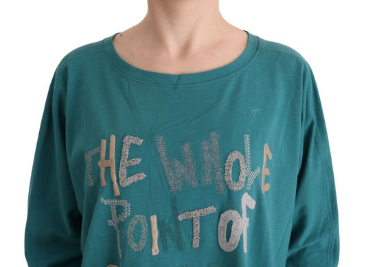 The shirt is green with a phrase written on it
