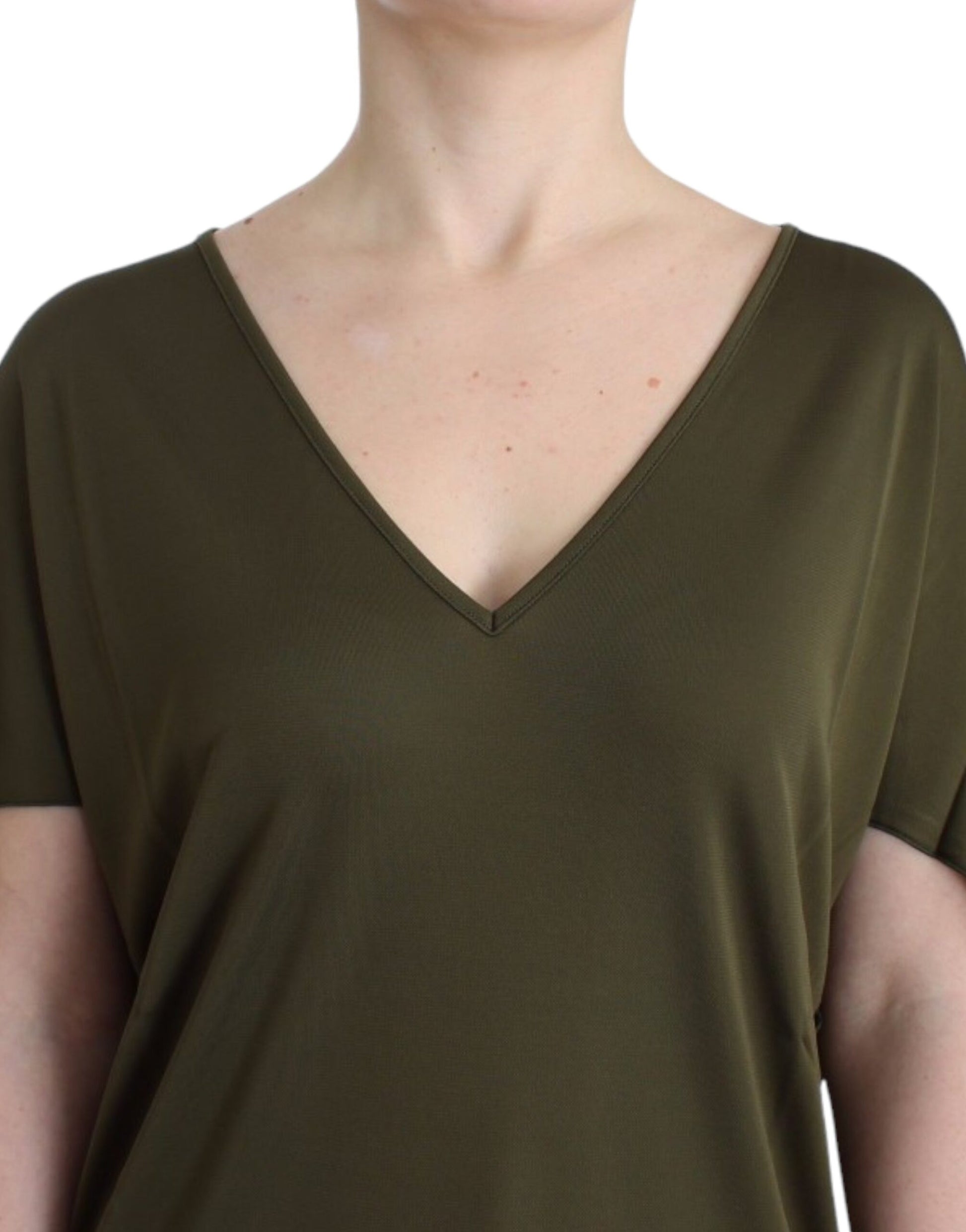 Woman wearing a green long sleeve top
