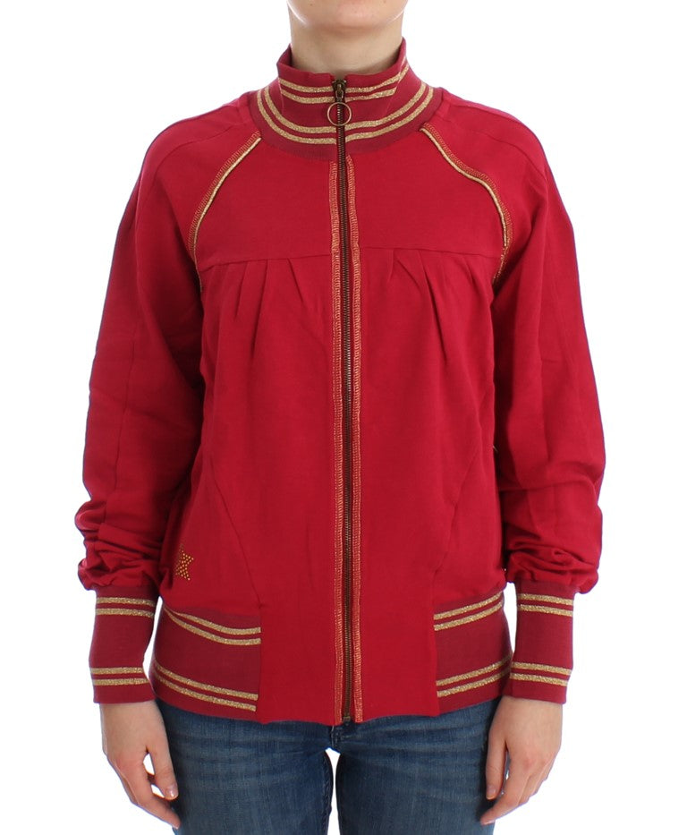 Red jacket with gold trim worn by a person standing against white background