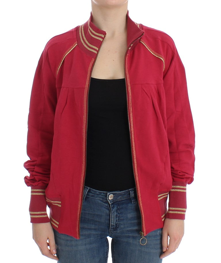 Red jacket with gold trim worn by woman