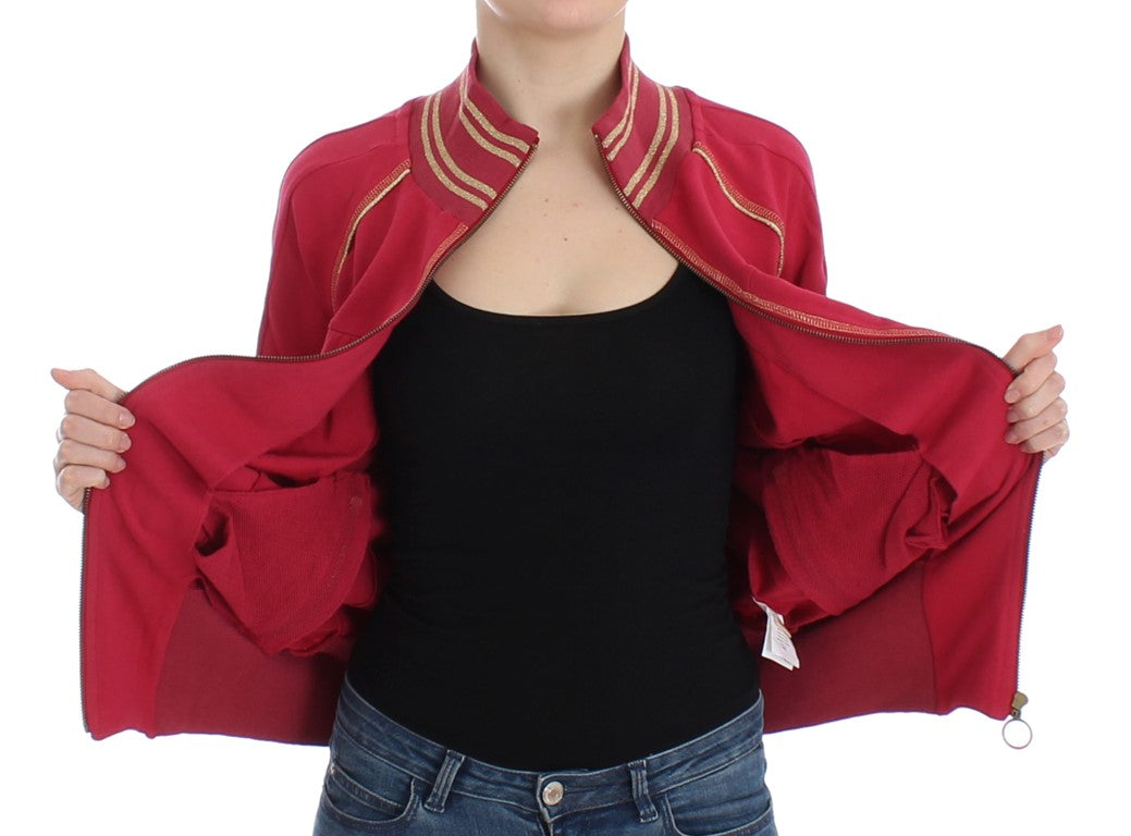 Woman wearing red jacket with gold trim