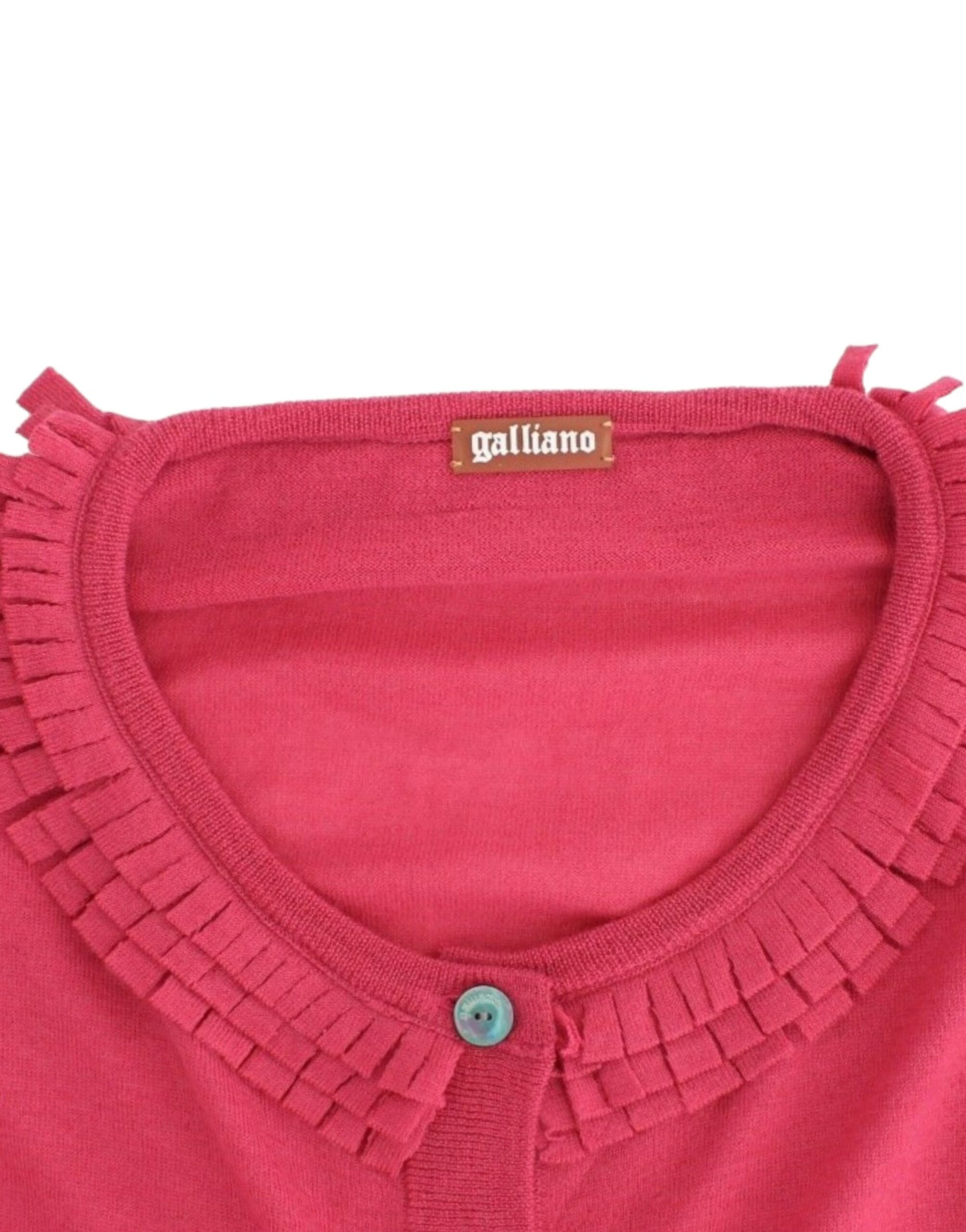 Red sweater on hanger with fringe trim