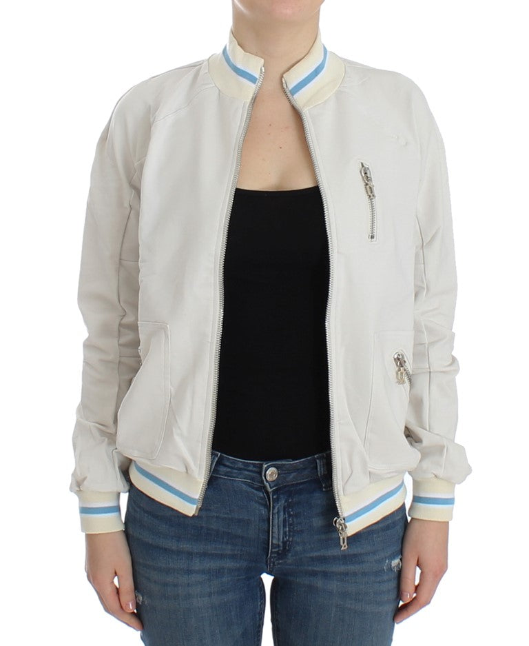 Woman wearing a light jacket over black top
