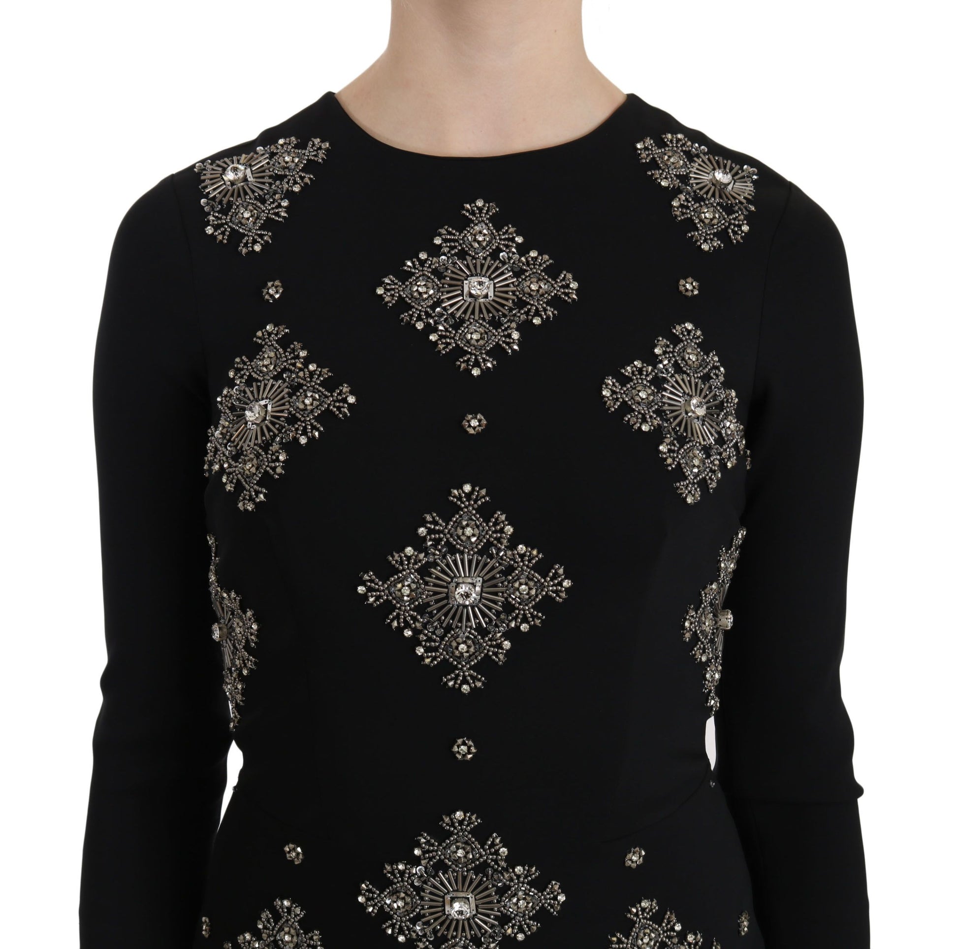 A black dress with crystal embellishments on the bodice