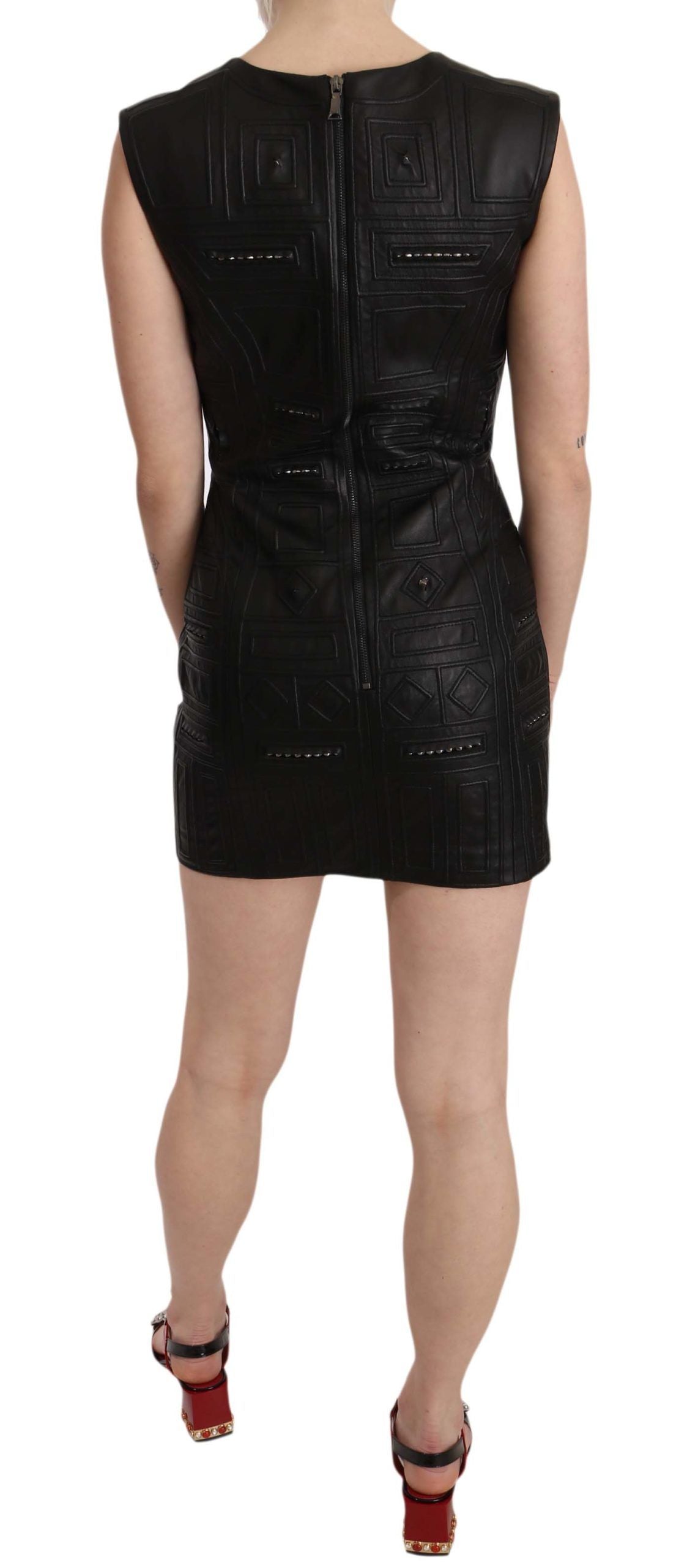 A black leather mini dress with studs on the front