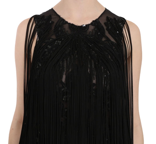 A black sequined dress with beaded detailing on a mannequin torso