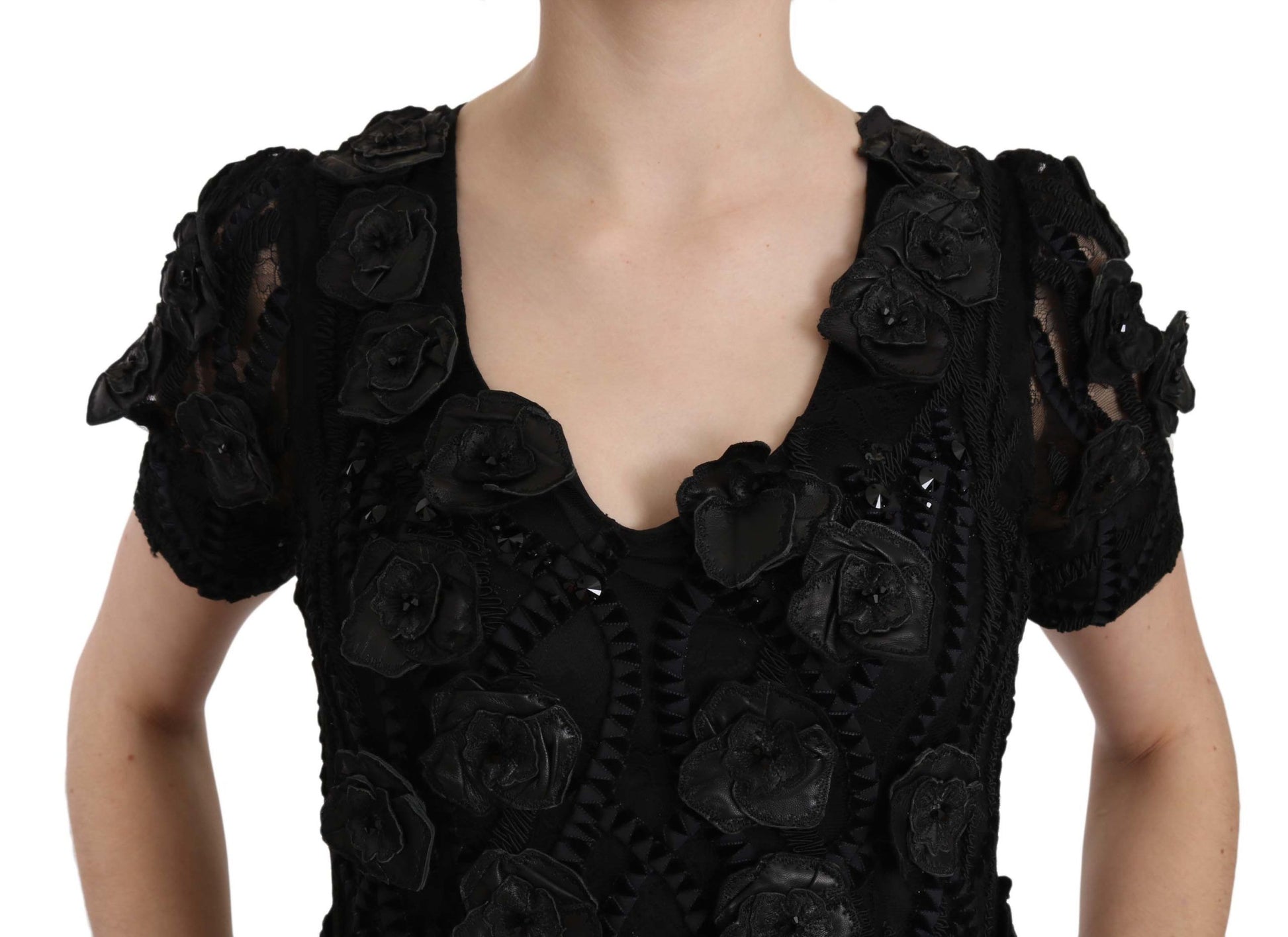 A black dress with floral embroidery on a silk base
