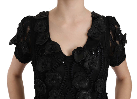 A black dress with floral embroidery on a silk base