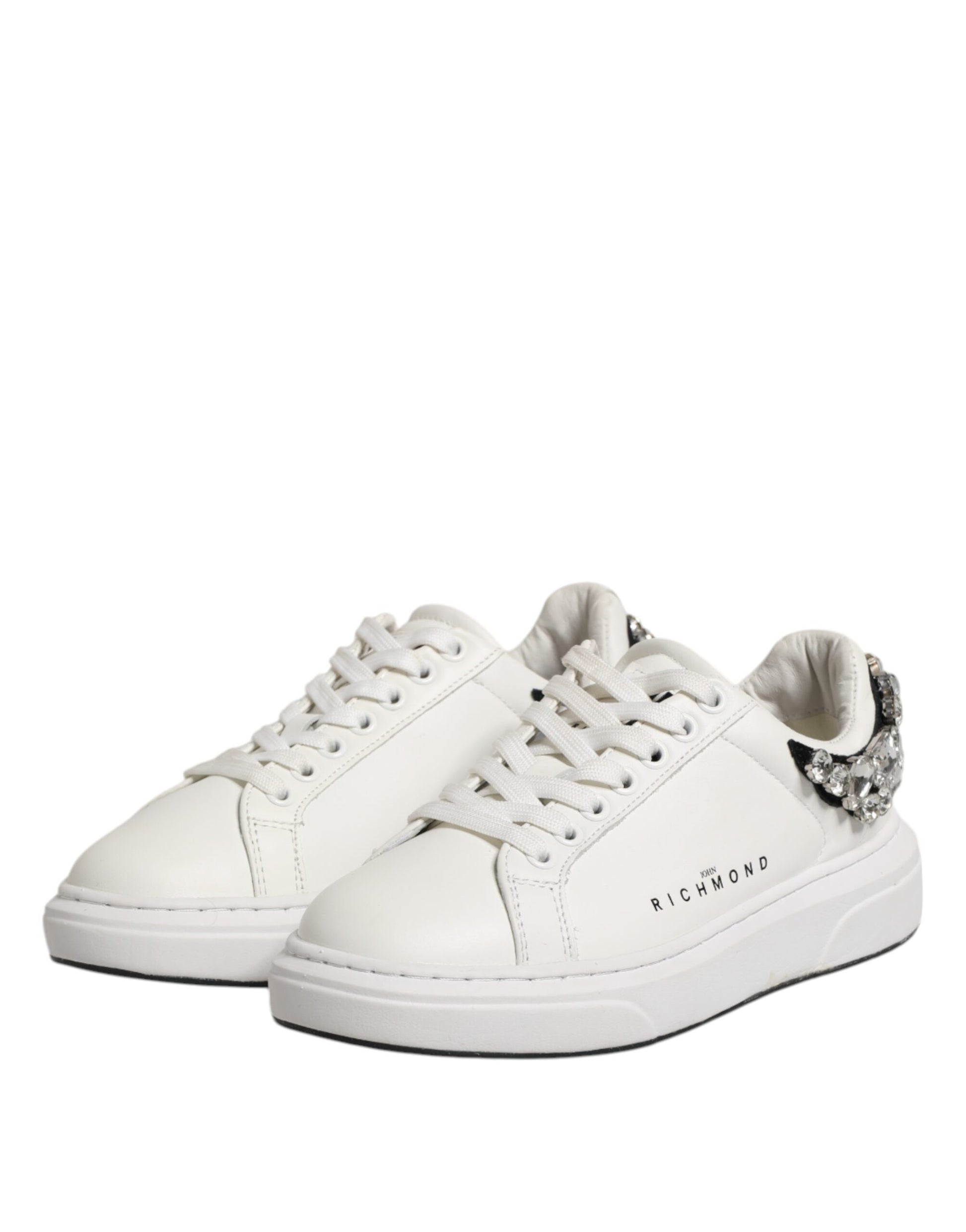 Pair of white sneakers with rhinestones, featuring a low-top design and lace closure