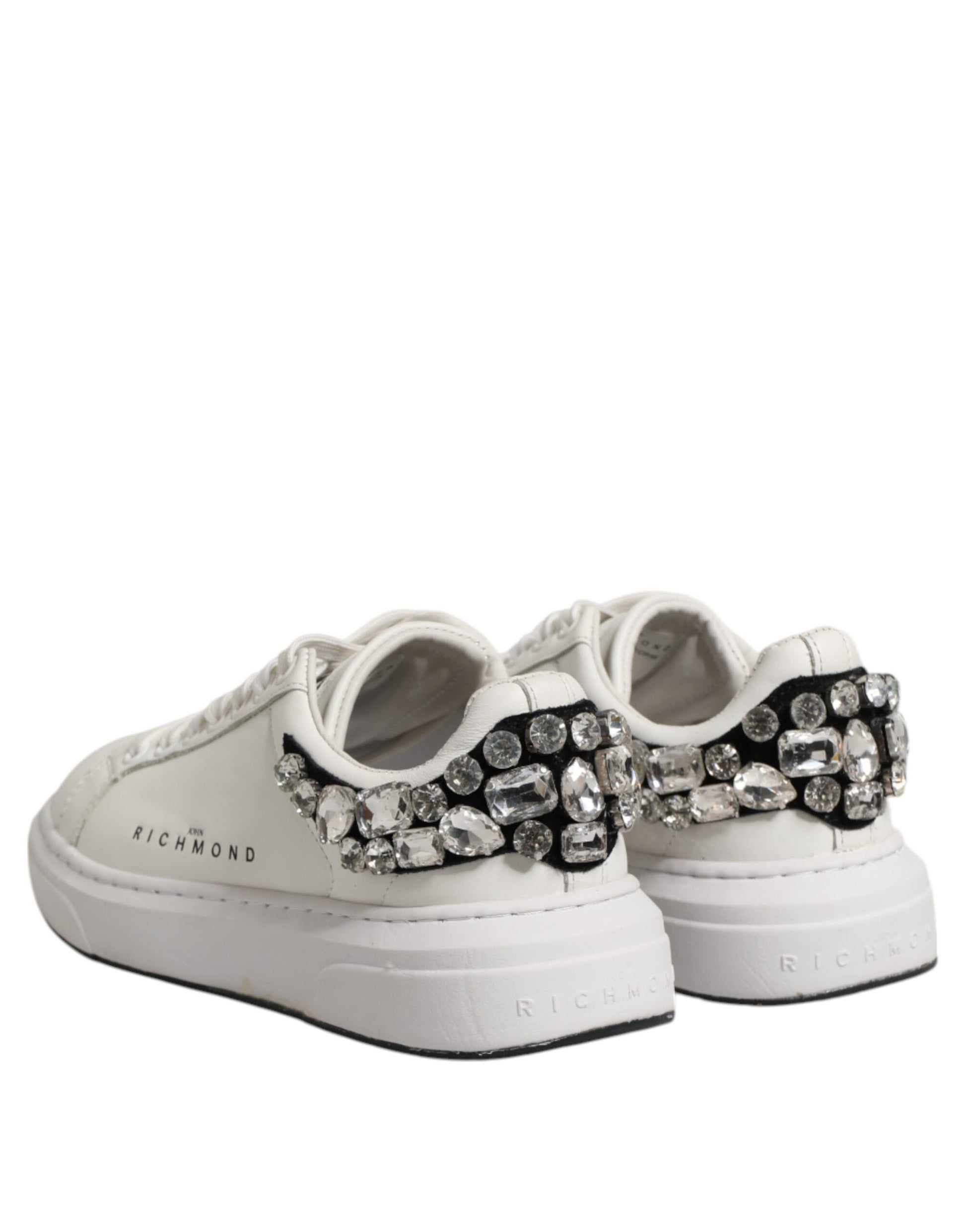 Pair of white sneakers with rhinestones on sides, by John Richmond brand