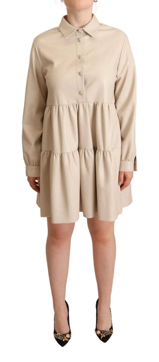 Tan leather dress with collar and long sleeves, worn by a person