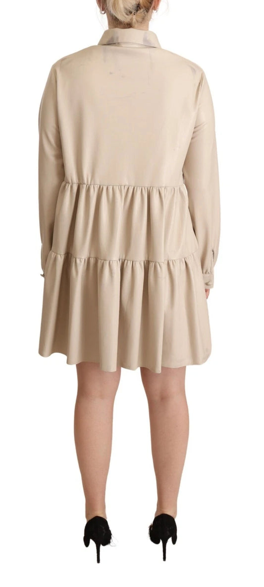 Tan leather dress with long sleeves and collar, featuring an A-line silhouette
