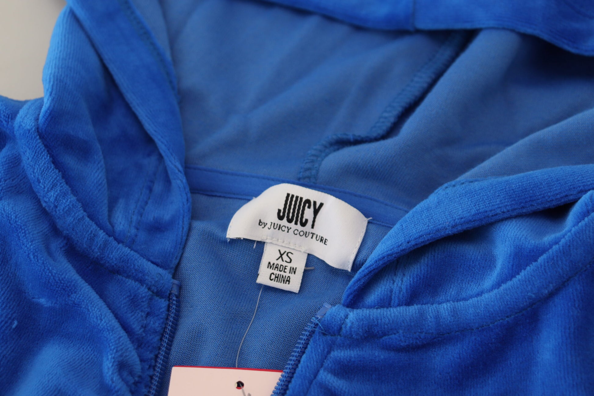 Blue hoodie on a hanger