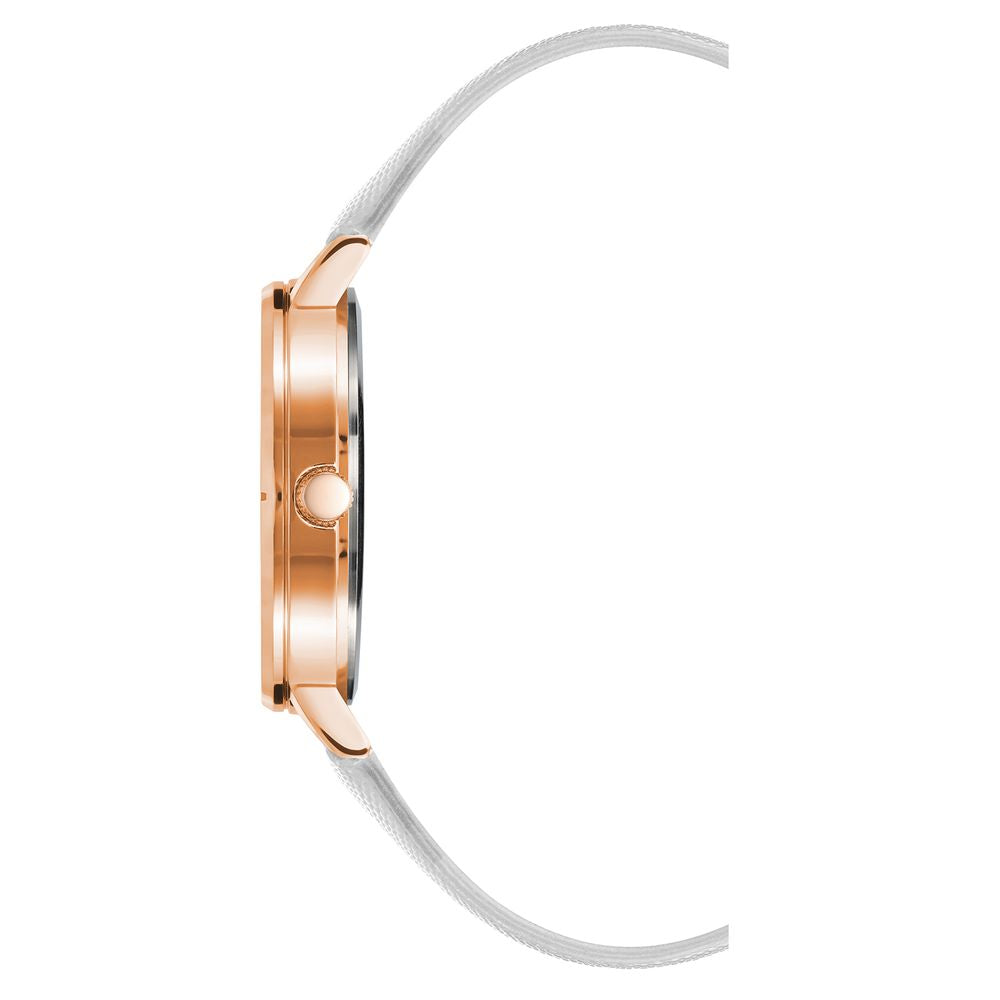 A rose gold watch with a white band