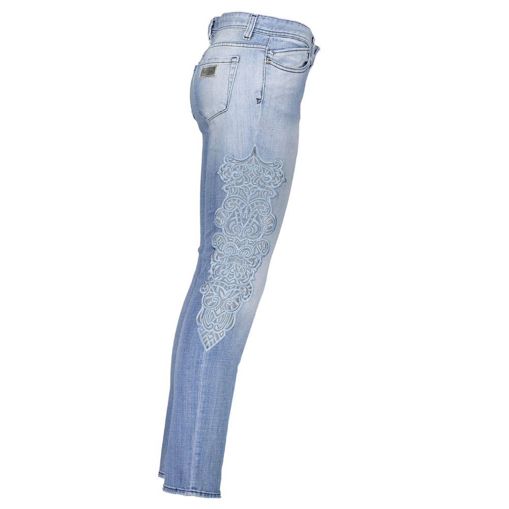 Pair of blue jeans with embroidered design on right leg