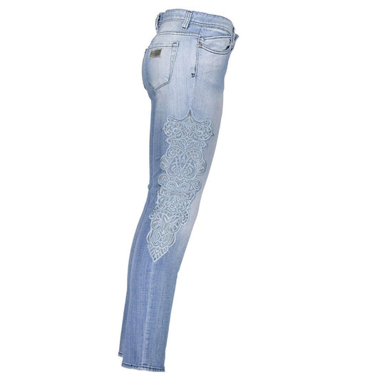Pair of blue jeans with embroidered design on right leg