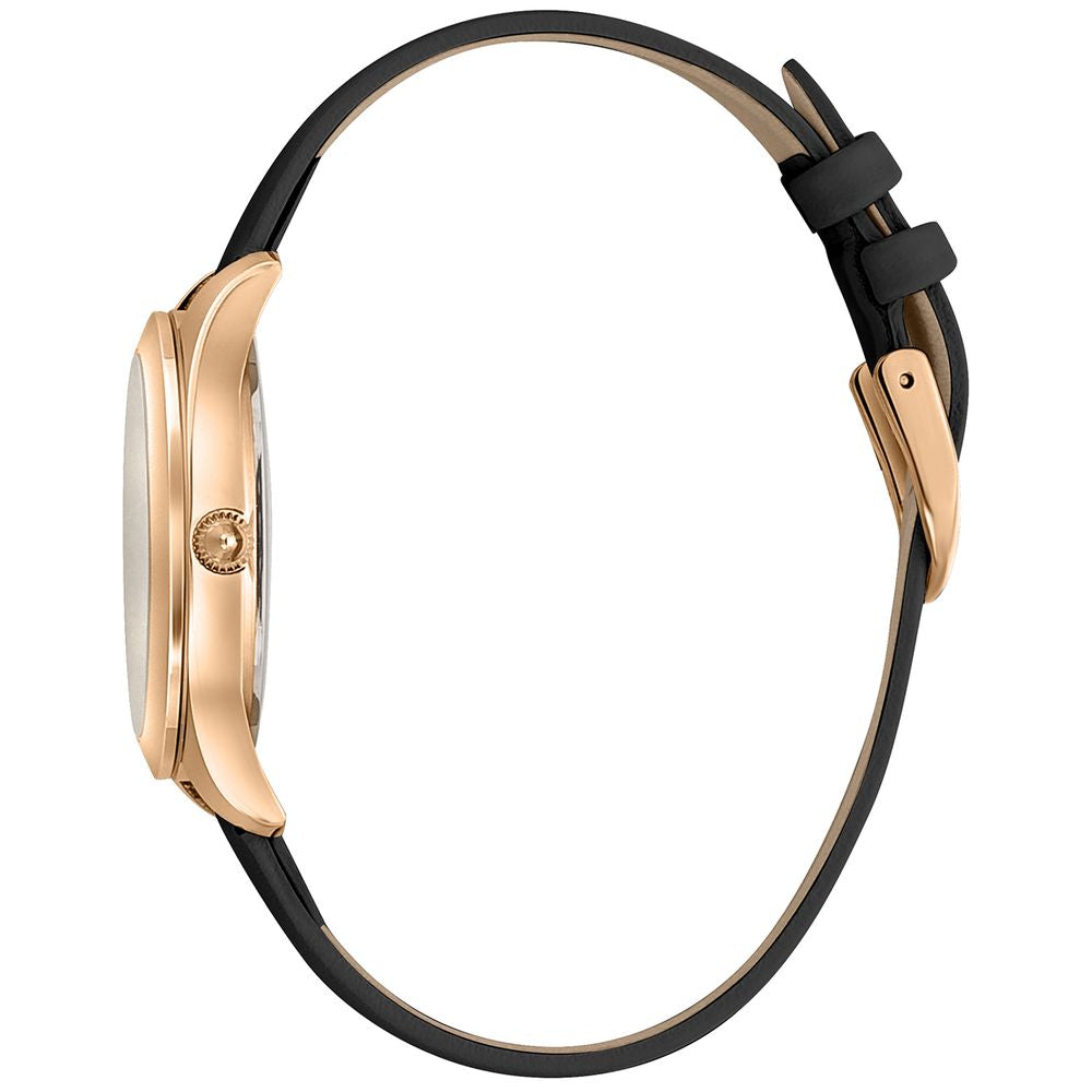 A black leather watch with gold accents