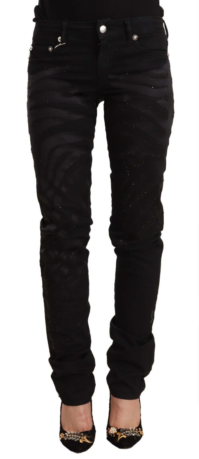 Pair of black skinny jeans with embellishments on legs