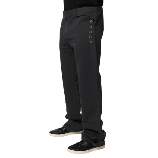 Man wearing black pants with buttons down side