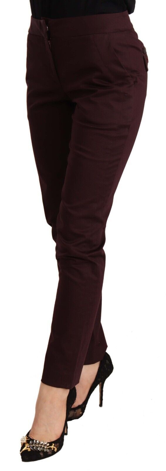 Woman wearing burgundy pants and black heels