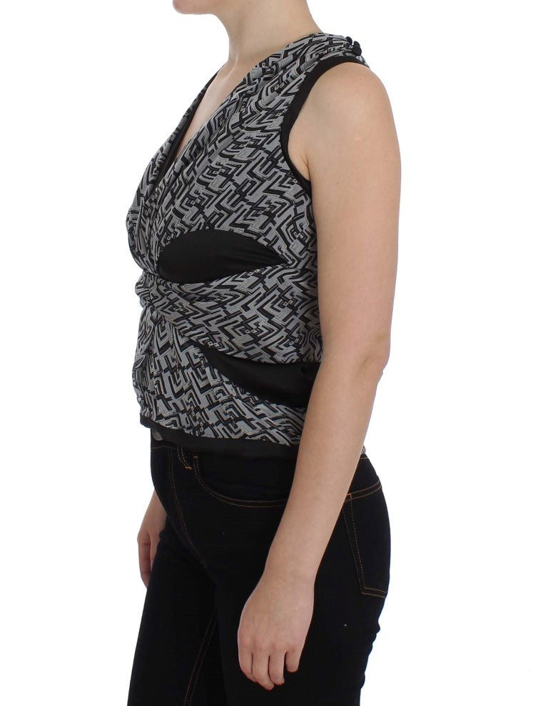 Woman wearing black tank top with gray patterned design