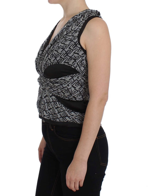 Woman wearing black tank top with gray patterned design