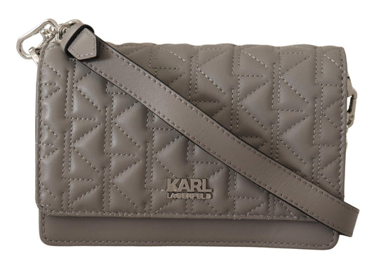 Brown quilted leather crossbody bag with metal clasp and adjustable strap