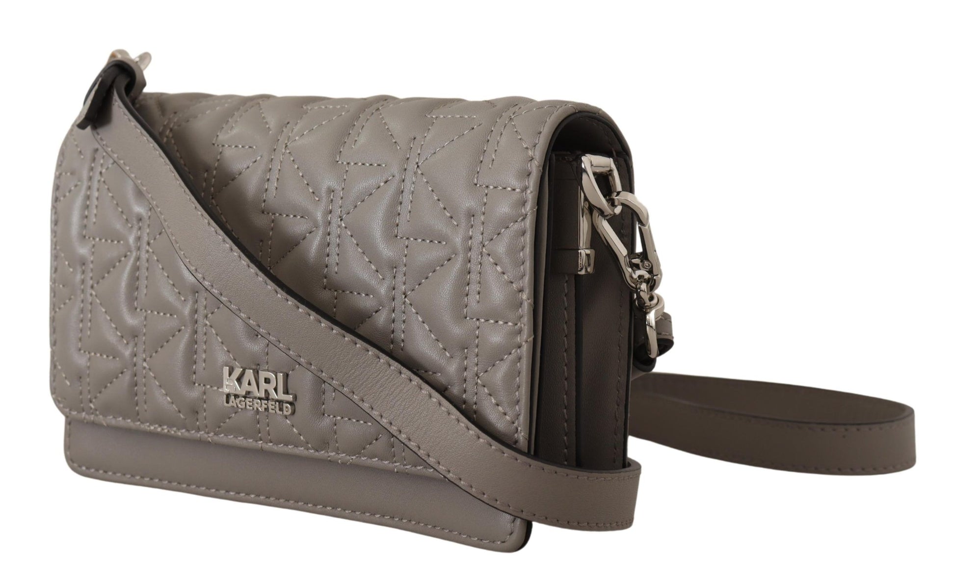 Grey quilted handbag with black straps and hardware
