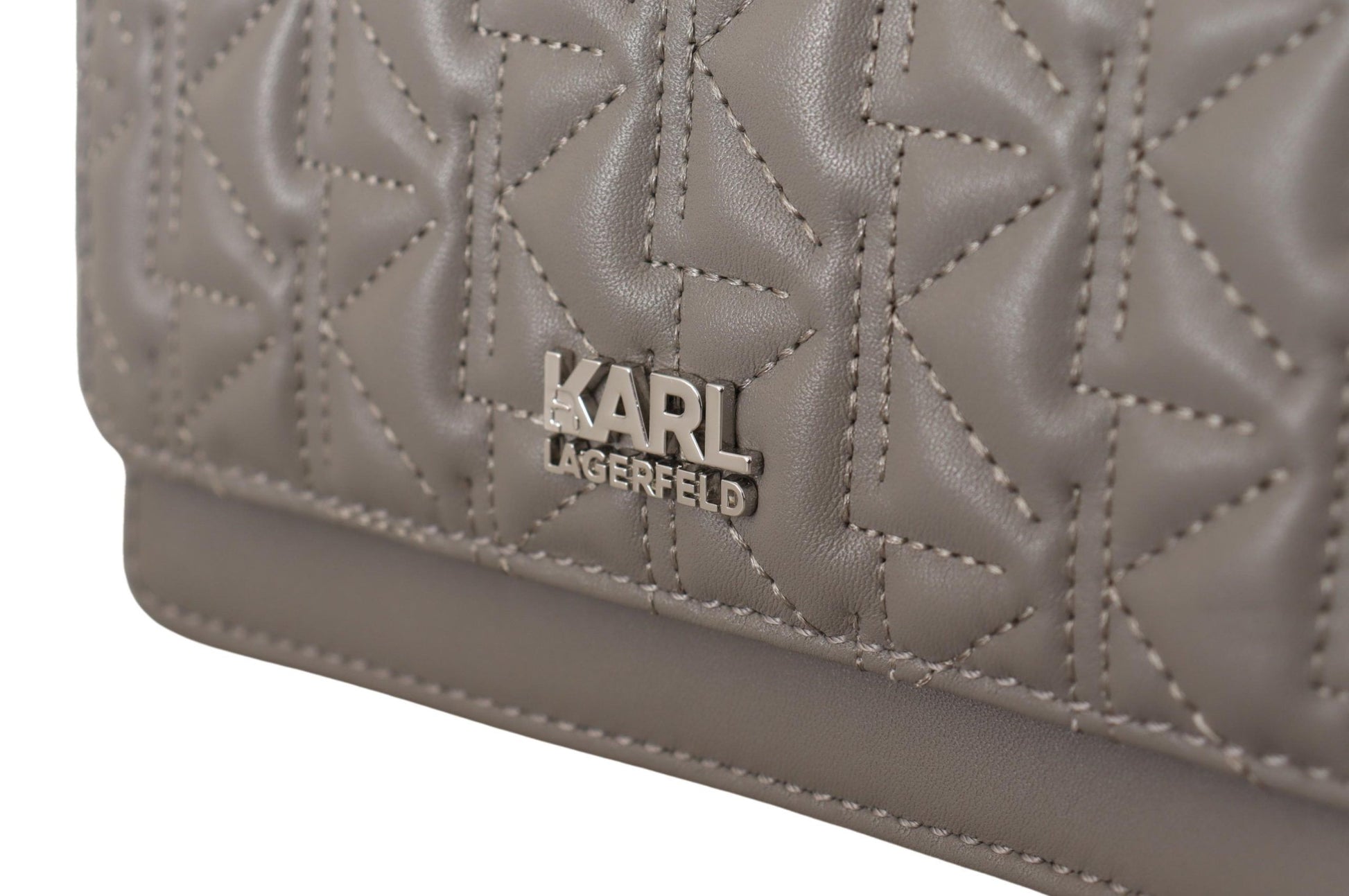Brown leather handbag with embossed design on front