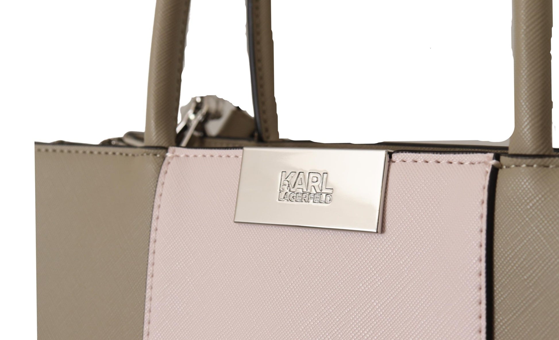 Pink and tan purse with metal accents