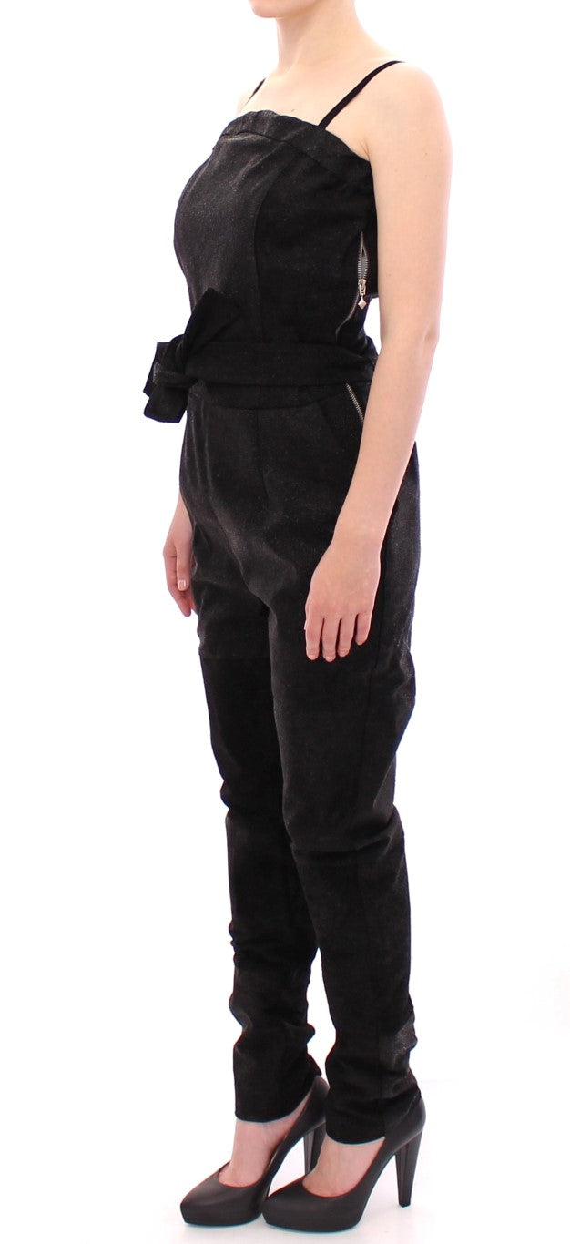 Woman wearing black pants and a dress