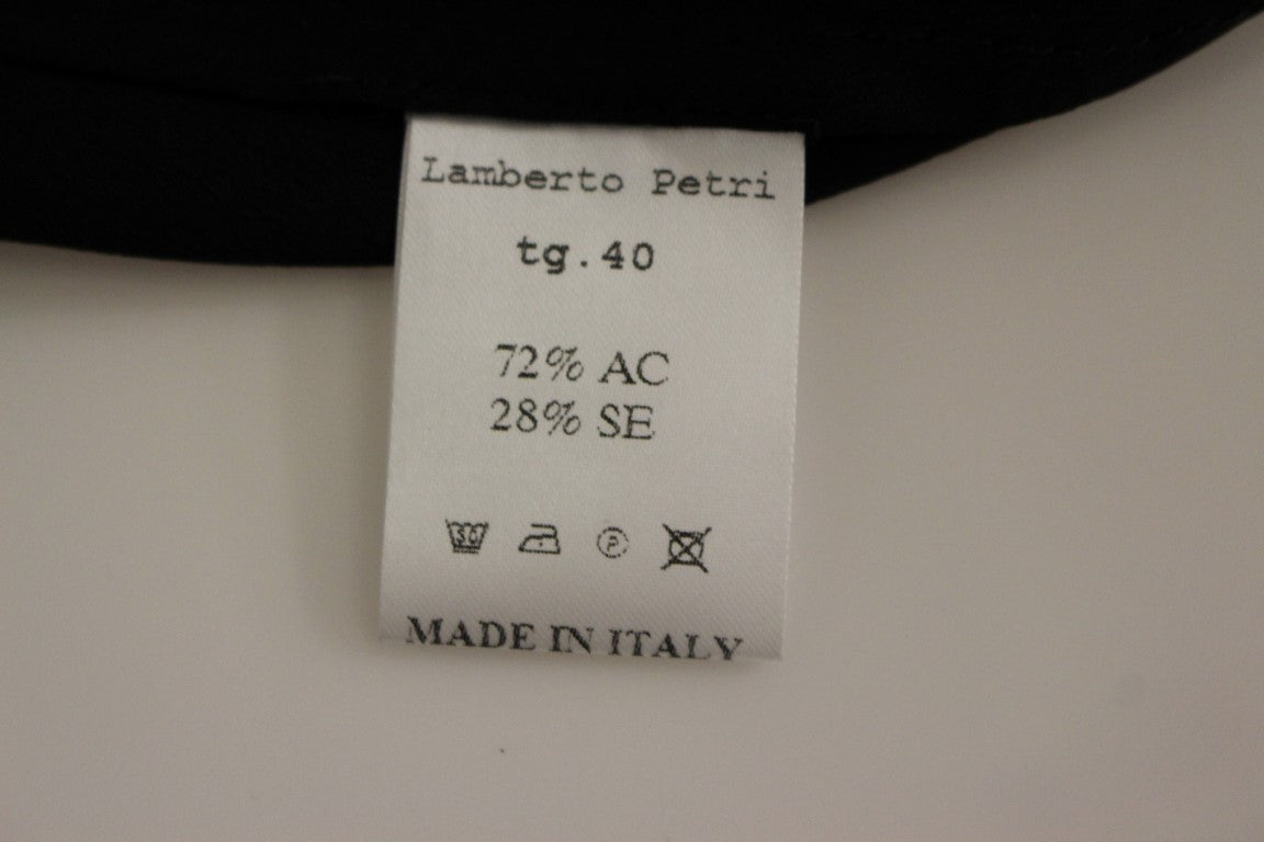 Tag on clothing indicating brand, size, material, care instructions, and country of manufacture