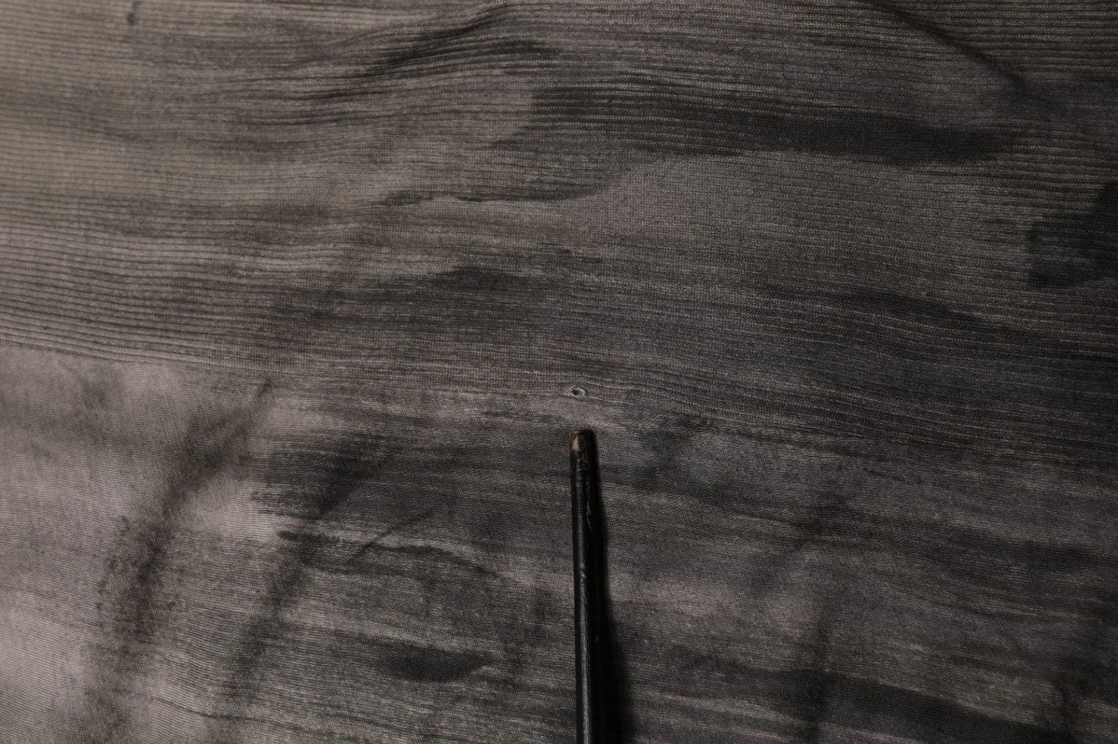 Black pen on fabric surface