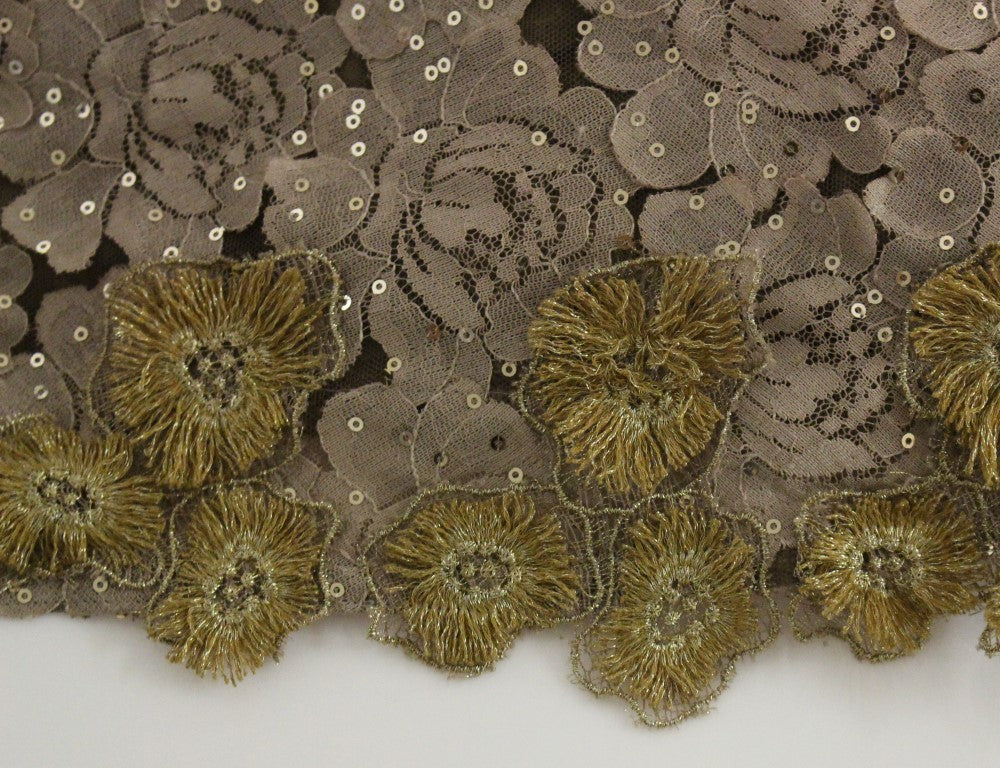 Decorative fabric with gold sequins and embroidered flowers