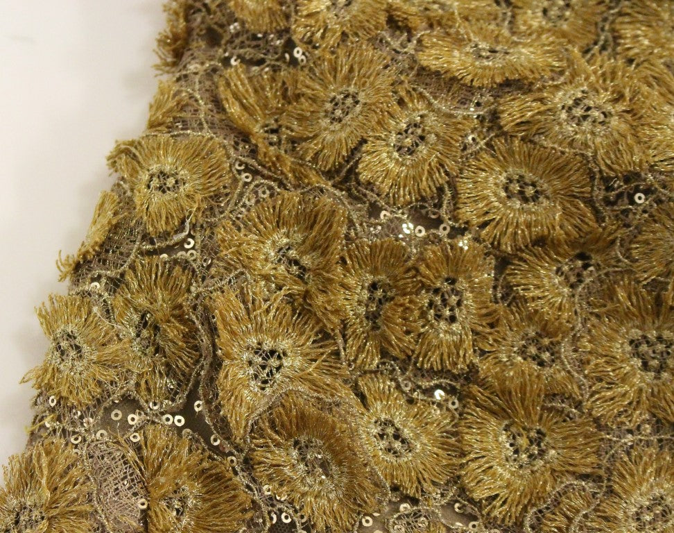 Gold sequined embellishments on fabric