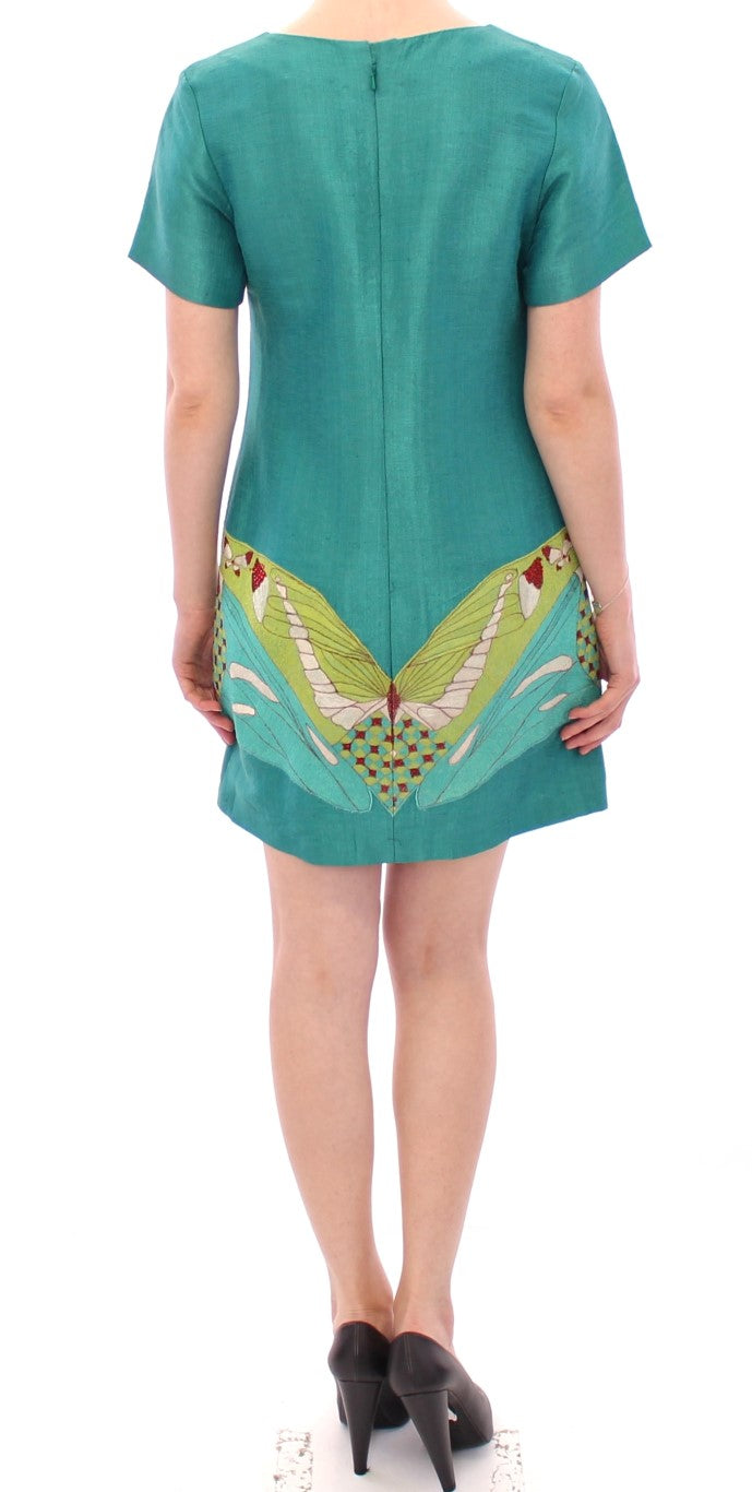 Green dress with bird design on back