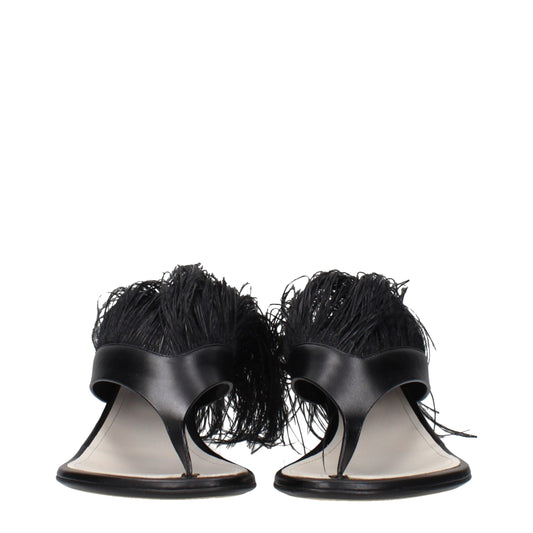 Pair of black high heel sandals with fringe details