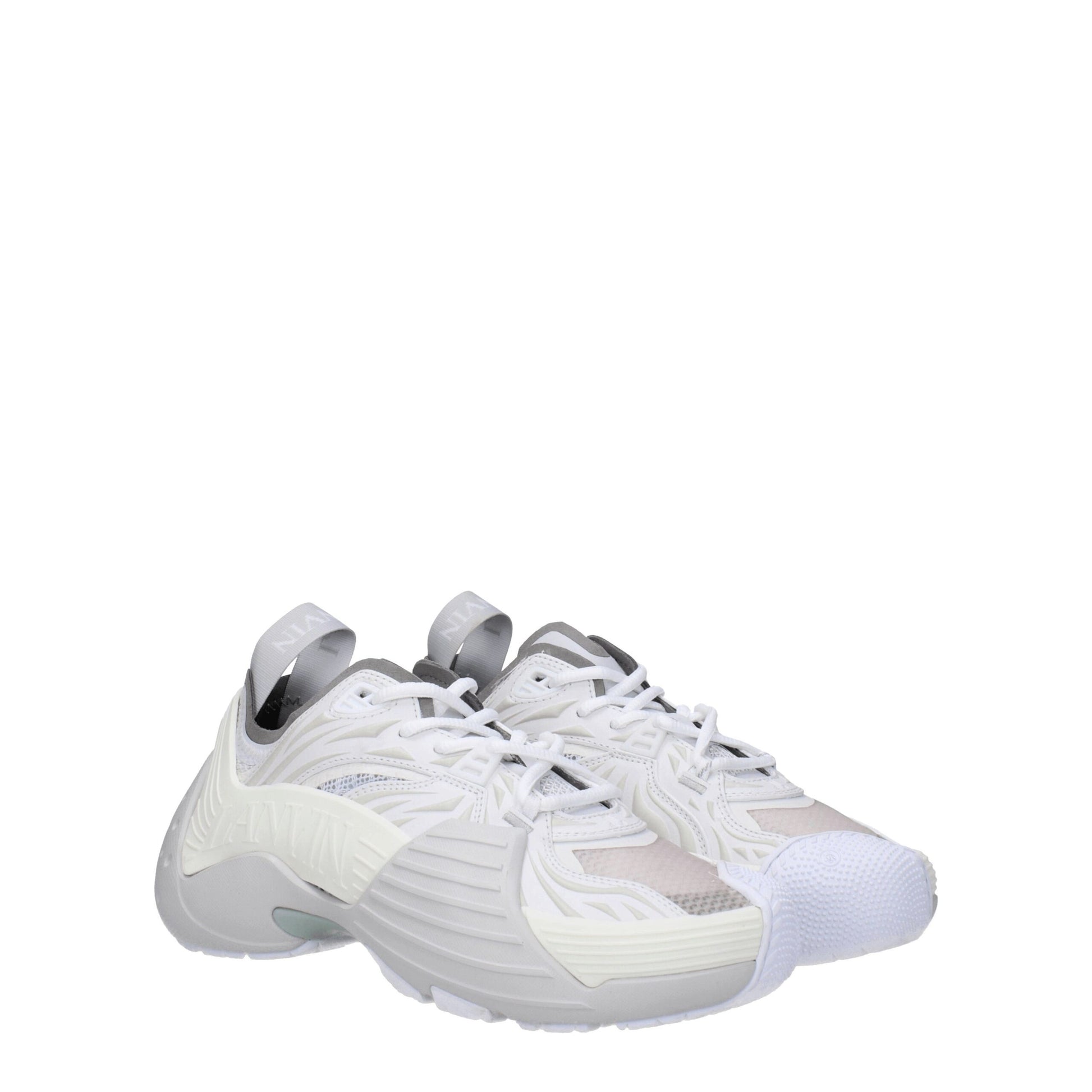 Pair of white leather athletic sneakers with laces, featuring a low-top design and a flat sole