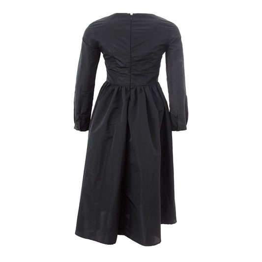 A black cocktail dress with a high neckline, long sleeves, and a flared skirt