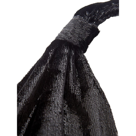 A black cocktail dress with a textured fabric