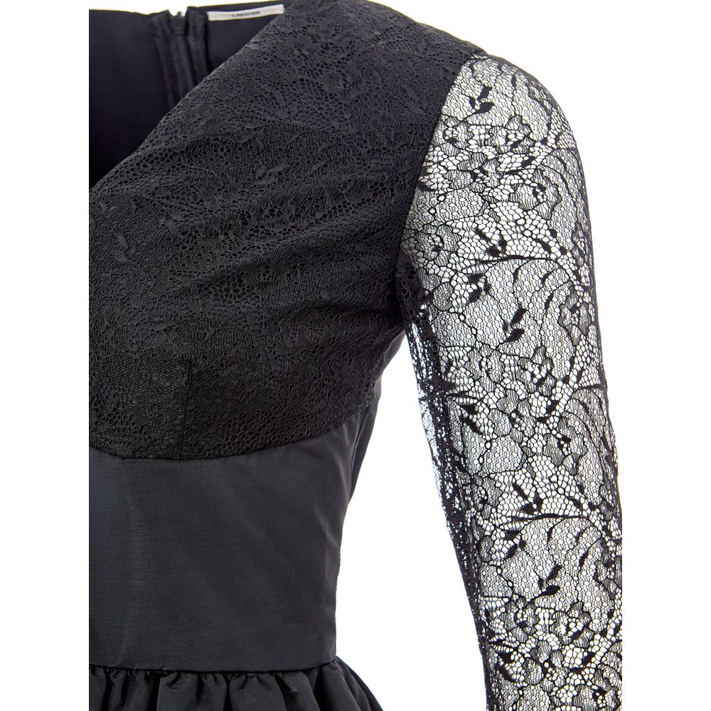 A black lace sleeve on a dress