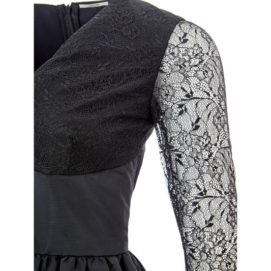 A black lace sleeve on a dress