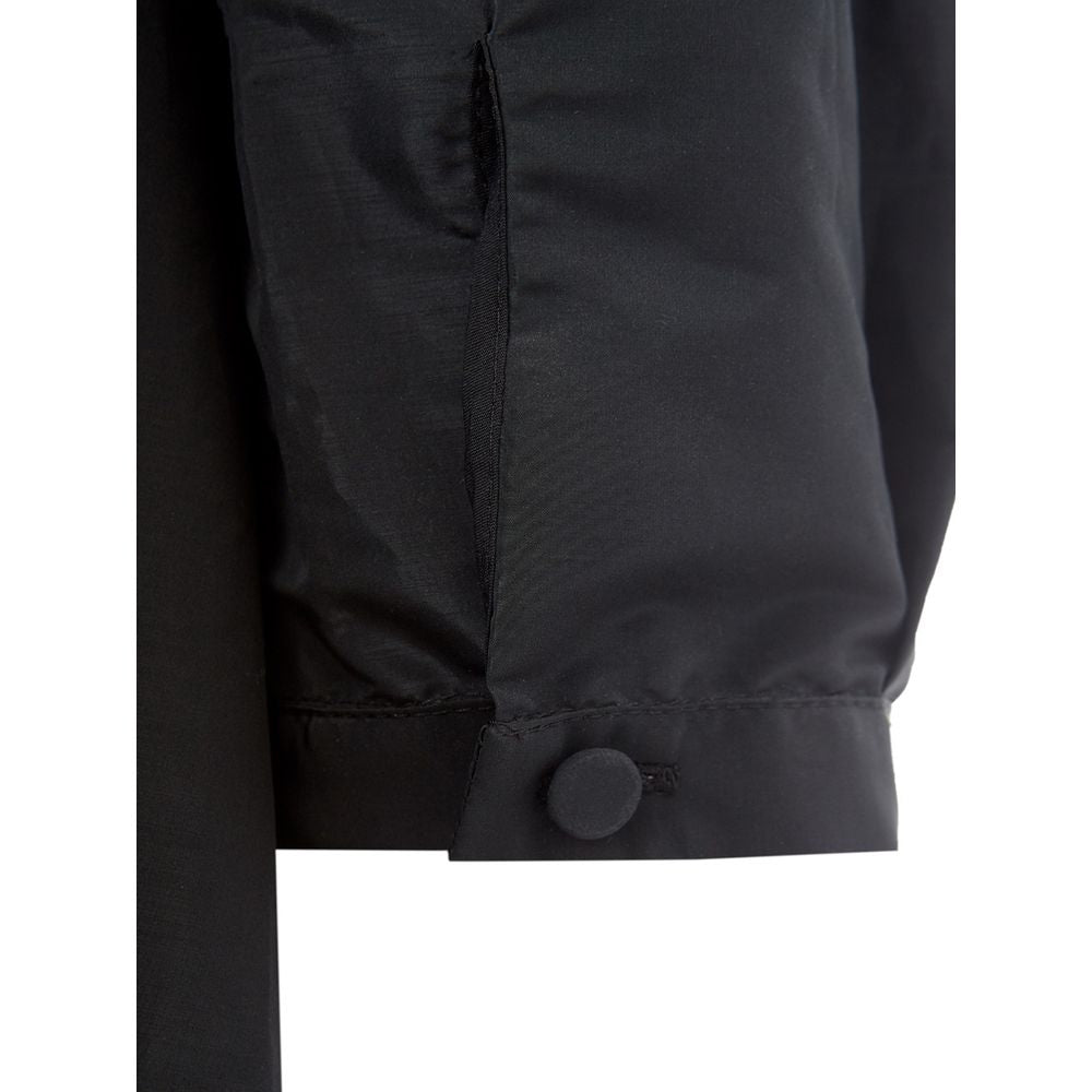 A black polyester cocktail dress with a buttoned front panel