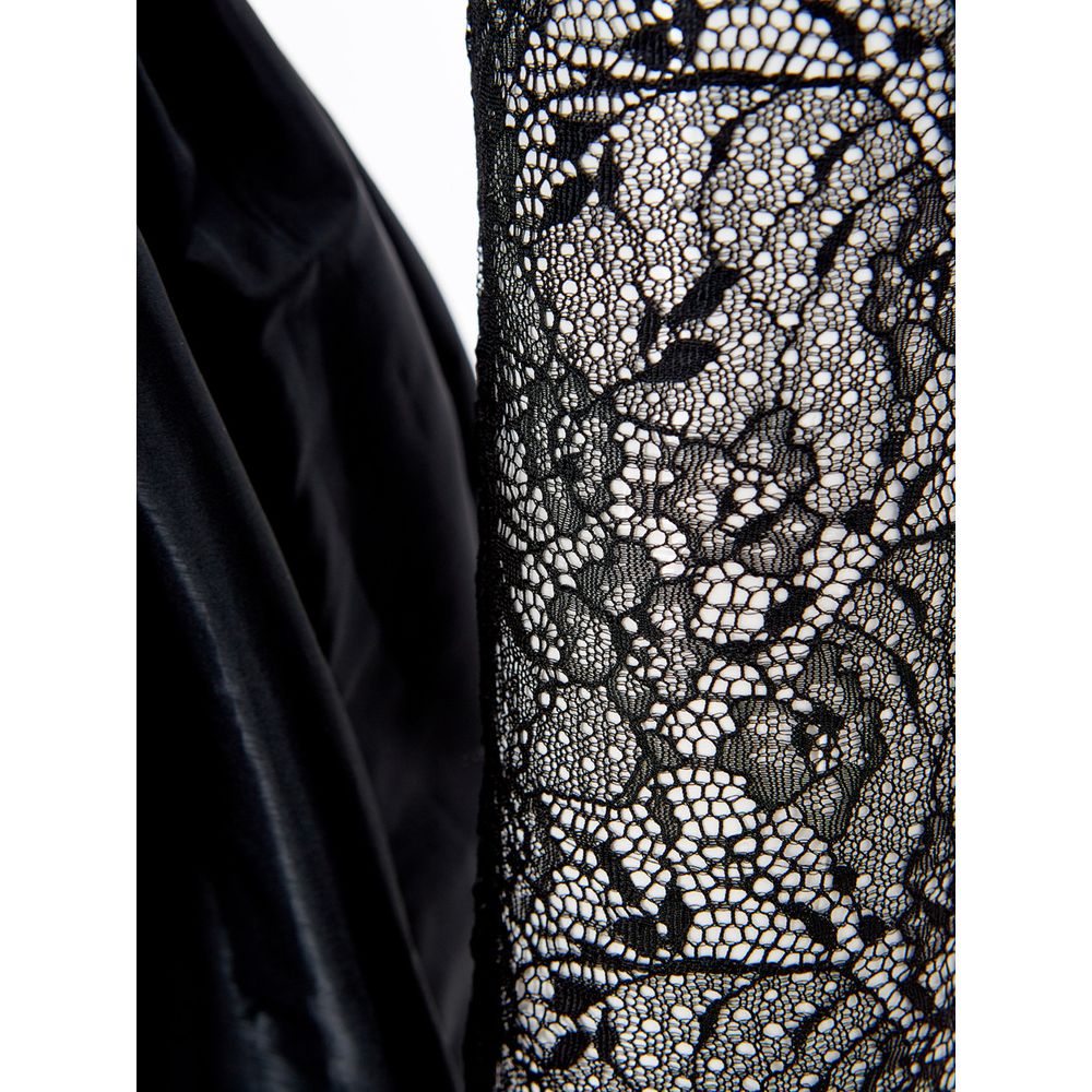 A black lace dress sleeve with intricate patterns, part of a cocktail dress