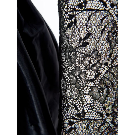 A black lace dress sleeve with intricate patterns, part of a cocktail dress