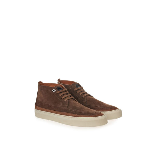 Brown suede boots with white soles and laces